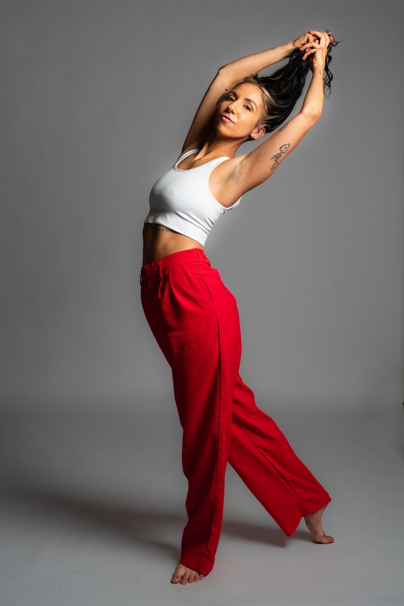 Dancer in studio with red pants