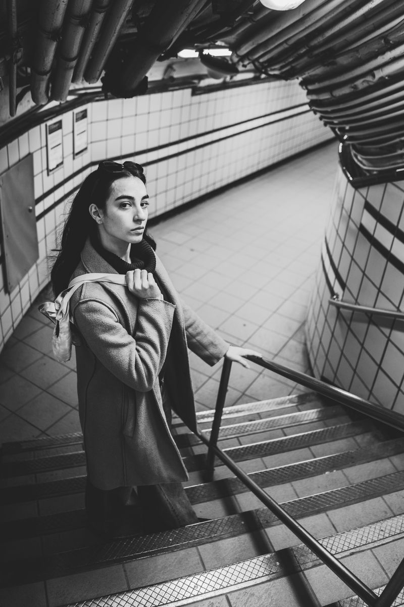 Portrait on subway stairs in black and white